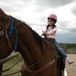 small girl on horse